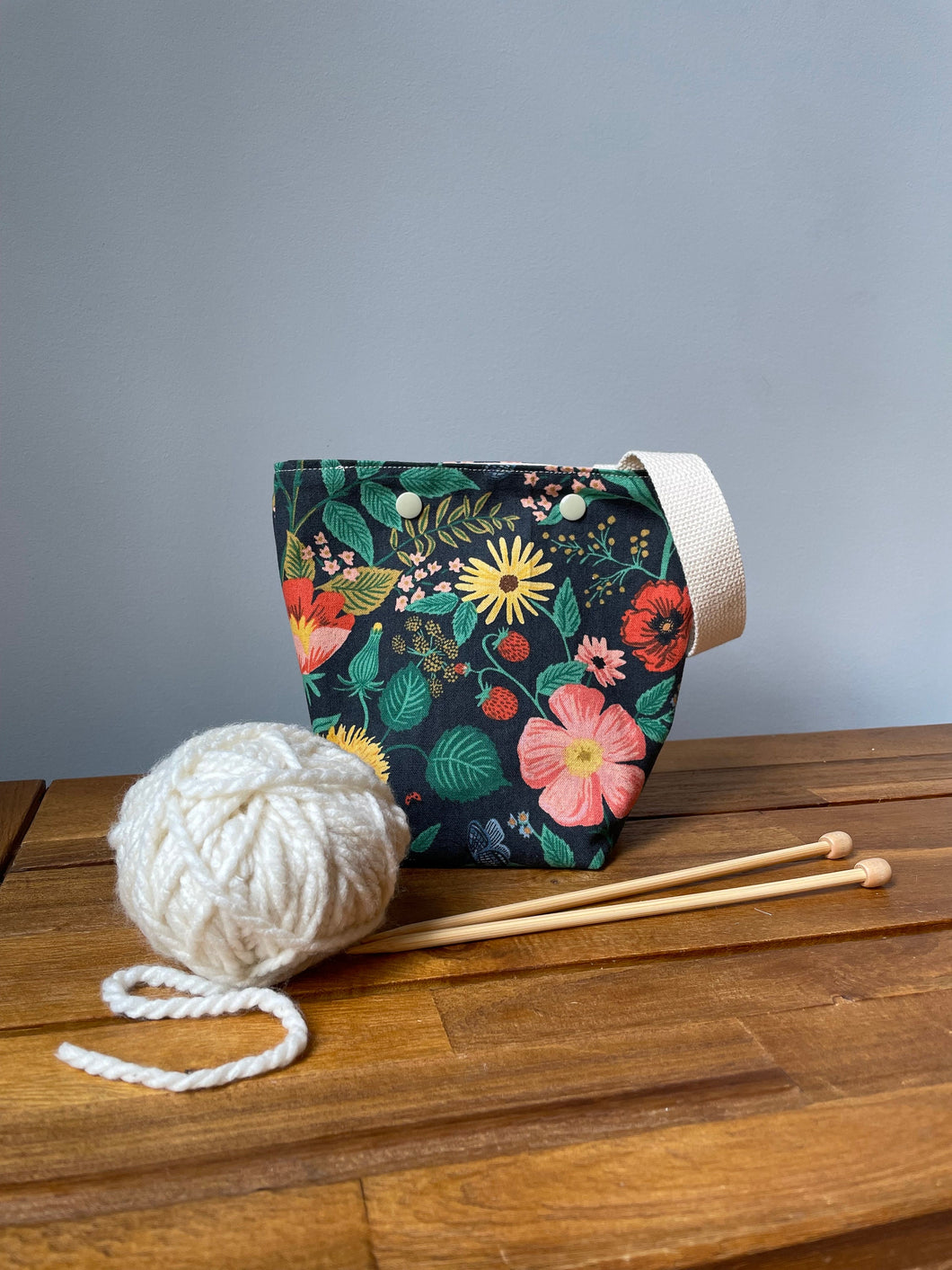 Black floral Rifle Paper co yarn ball bag with handle for knitters